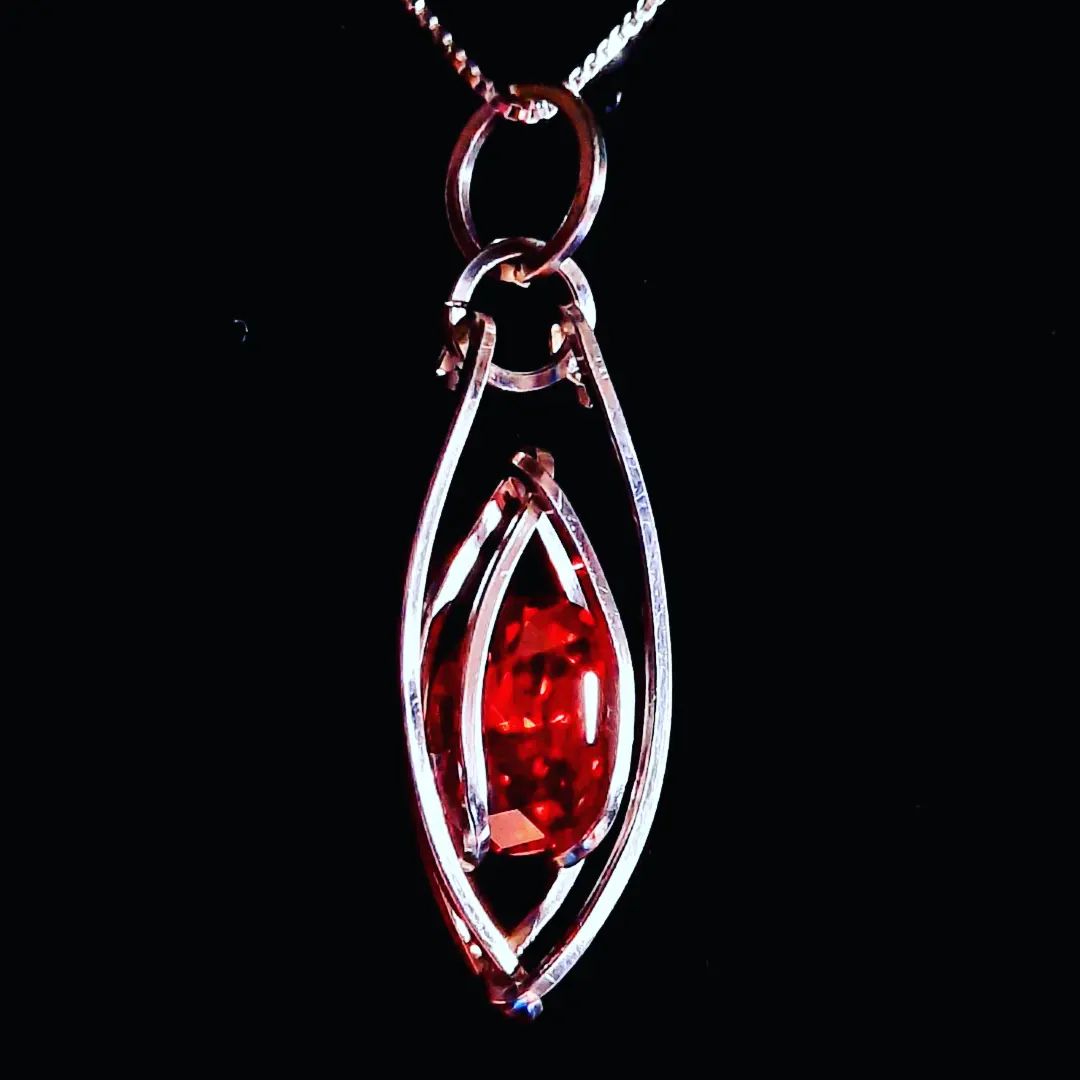 Ruby pendant (not a real ruby...) it took me 3 tries to get this one. #wirewrappedjewelry #wirewrap #jewelry #pendant #thirdtryisacharm